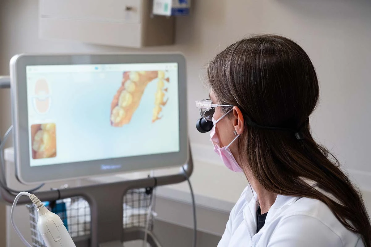 Dr. Marcy Walker prepping a patient for hybrid dentures